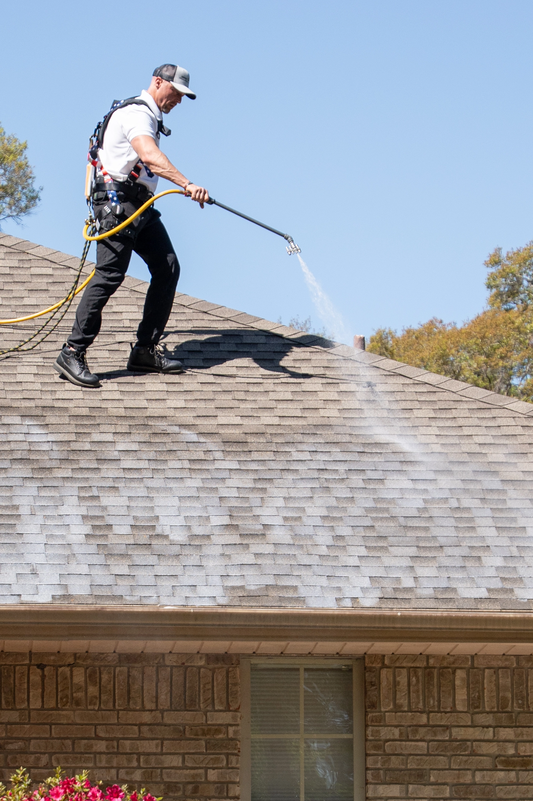 roofer cleaning a roof