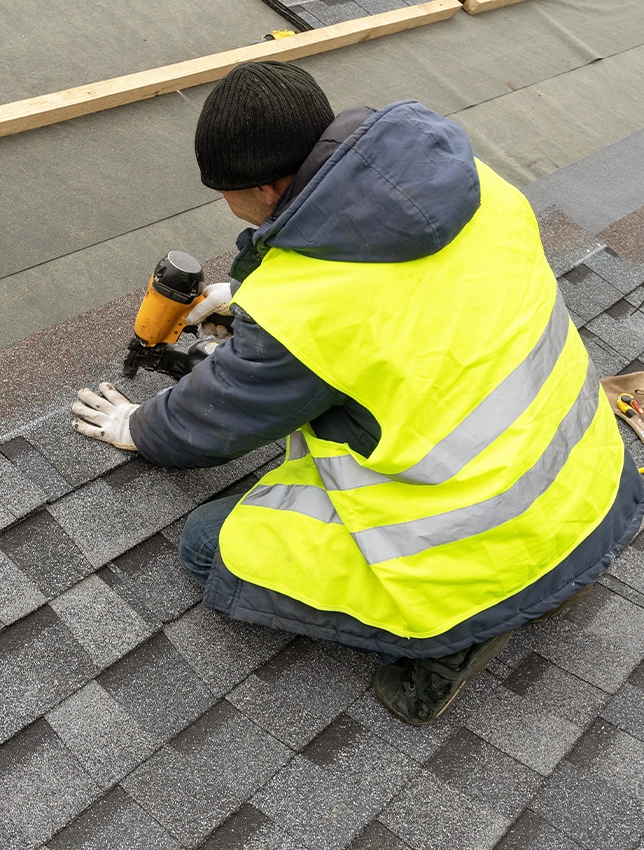 roofer repairing roof
